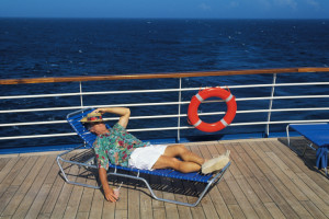 picture of man sleeping on deck of ocean cruise ship