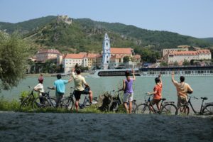 Picture of passengers from a river cruise boat using the bicycles that are kept on board